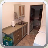 Laundry showing sink and cabinet